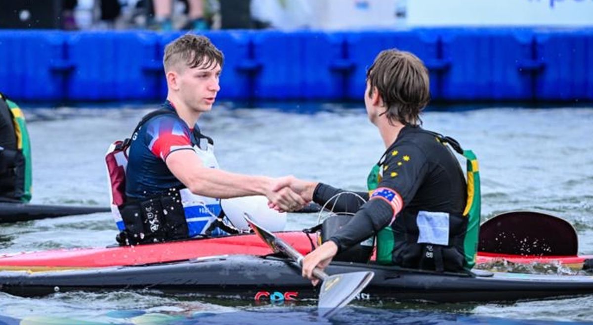 Henry McCann with a fellow competitor in the ICF Canoe Polo World Championships